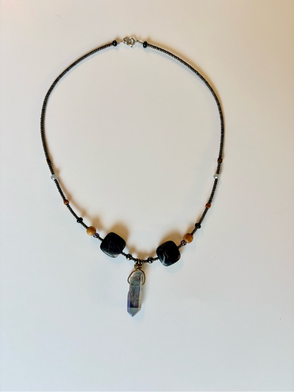 Black Bead Necklace with Blue Crystal Pendant